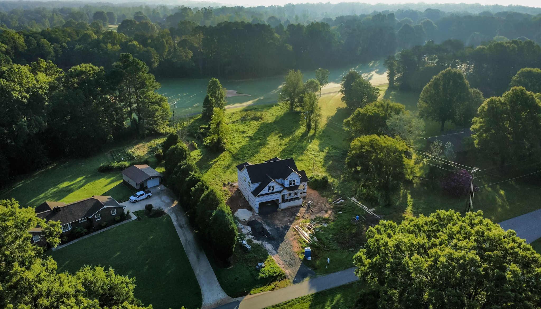 A home under construction in soft morning light